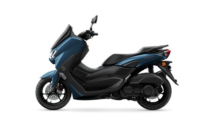A side view of a blue Yamaha NMAX scooter, showcasing its sleek design, larger front wheel, and modern aesthetic features.