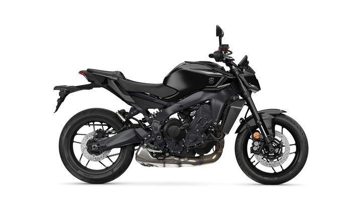 A sleek black motorcycle positioned at a 45-degree angle, showcasing its sporty design, front and rear wheels, and prominent engine details.
