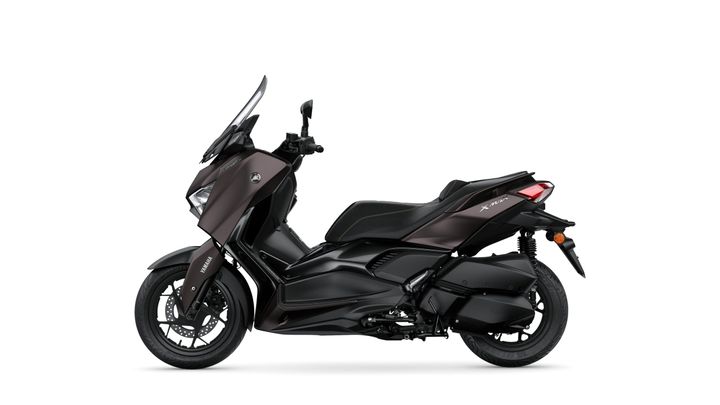 Side view of a sleek, matte black Yamaha X-Max scooter, showcasing its modern design, sporty lines, and dual-tone bodywork.