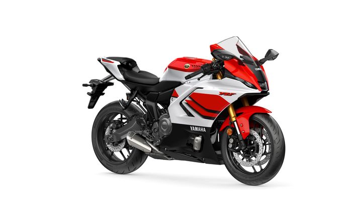 Yamaha 2026 R7 A sleek red, white, and black Yamaha YZF motorcycle is displayed, featuring a sporty design, aerodynamic fairings, and prominent branding on the side.