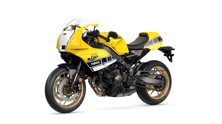A vibrant yellow and black Yamaha motorcycle with a sporty design, featuring a prominent front fairing, sleek bodywork, and distinctive gold wheels.