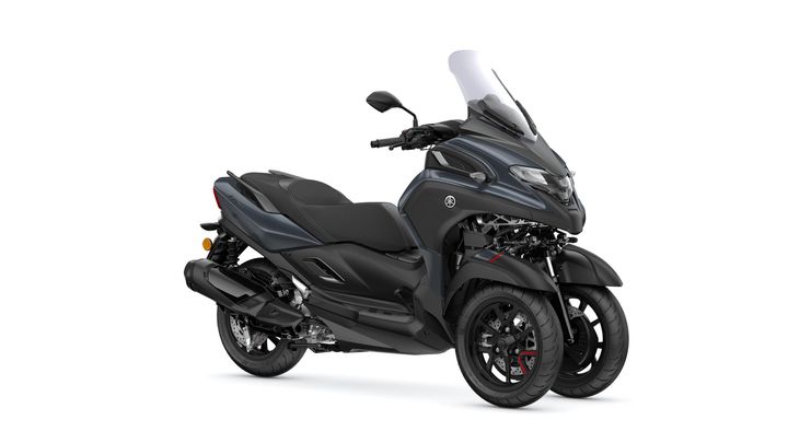 A sleek, gray three-wheeled scooter with a prominent windshield and sporty design, showcasing a modern and dynamic silhouette.