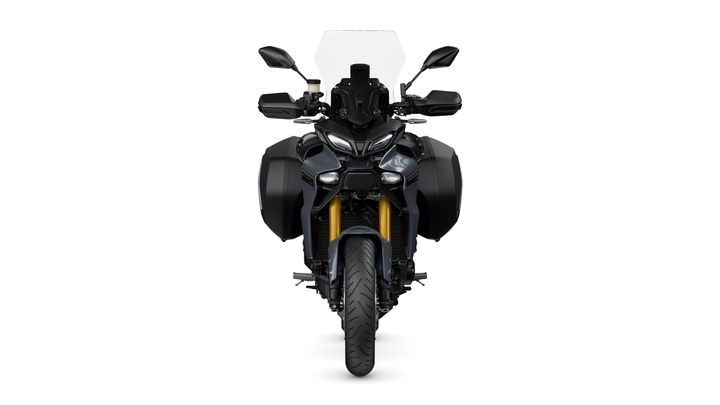 Front view of a motorcycle with a sleek black design, prominent headlights, a windscreen, and side luggage compartments.