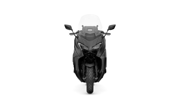 Front view of a sleek black motorcycle with a transparent windshield, showcasing its angular design and large front tire.