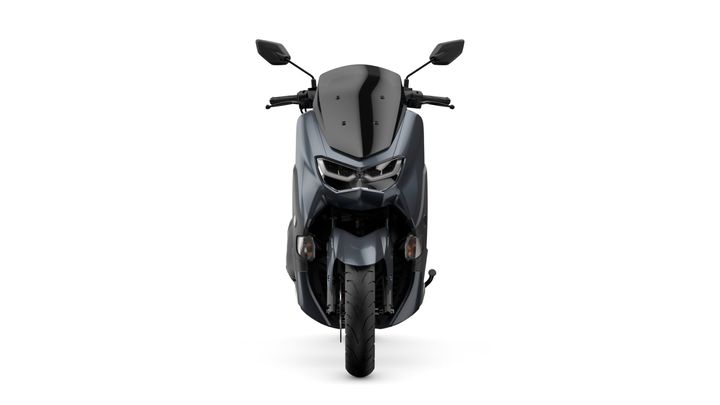 Front view of a sleek, modern motorcycle with a matte gray finish, showcasing its angular design, dual headlights, and streamlined bodywork against a white background.