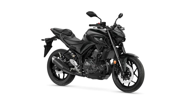 A sleek black Yamaha motorcycle is positioned in a three-quarter view, showcasing its sporty design, featuring a streamlined body, angular headlights, and modern wheels.