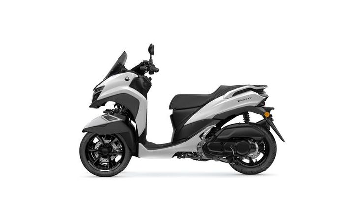 A sleek gray and white scooter with a modern design, featuring a large windshield, dual headlights, and a comfortable seat, positioned against a plain white background.