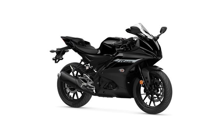 Yamaha 2024 R125 A sleek black sports motorcycle with a modern design, featuring aerodynamic fairings, a low-slung seat, and detailed graphics on the body. The bike is positioned at an angle, showcasing its front and side profiles, with a focus on the front wheel and exhaust pipe.