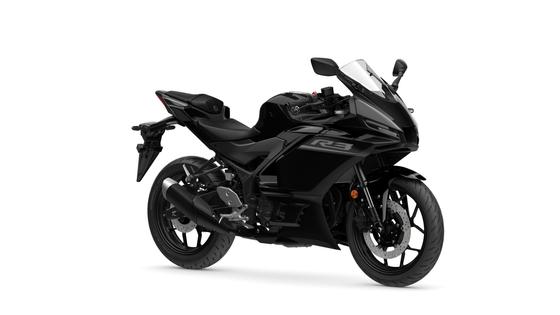 Yamaha 2026 R3 A sleek black Yamaha R3 motorcycle positioned at a slight angle, showcasing its aerodynamic body, sport seat, and dual headlights against a plain white background.