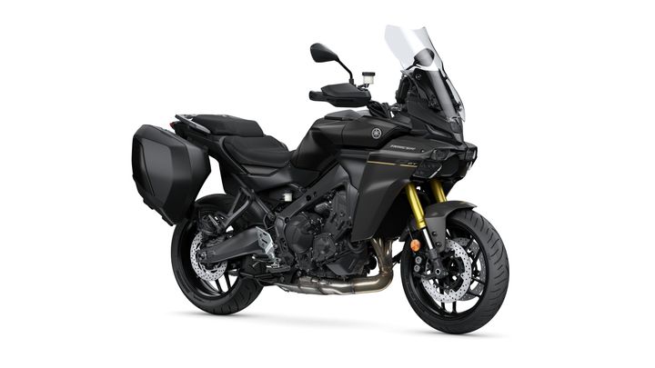 Yamaha 2025 TRACER 9 GT A black Yamaha Tracer 9 GT motorcycle with a sporty design, featuring a tall windscreen, saddlebags, and gold front forks, positioned at a slight angle against a white background.