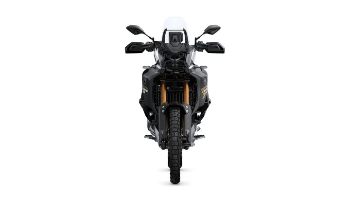 Front view of a black adventure motorcycle with prominent headlights, a tall windscreen, and rugged tires, set against a plain white background.