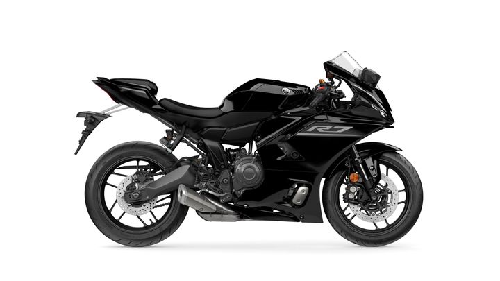 A sleek black sport motorcycle with a streamlined design, featuring a prominent R7 logo, sport fairings, dual front headlights, and a single exhaust on the right side.