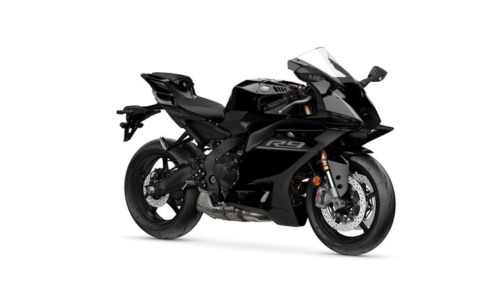 A sleek black sport motorcycle with an aerodynamic design, featuring a prominent fairing, low stance, and modern styling.