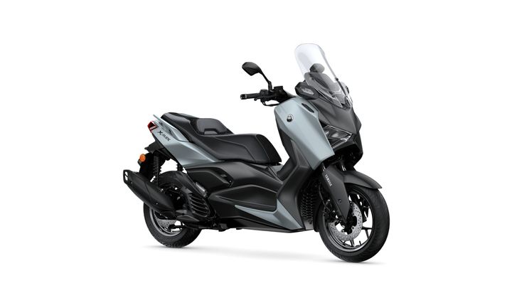 Yamaha 2026 XMAX 125 Tech MAX+ A modern scooter with a sleek design, featuring a light blue and black color scheme, a windshield, and sporty styling, positioned on a white background.