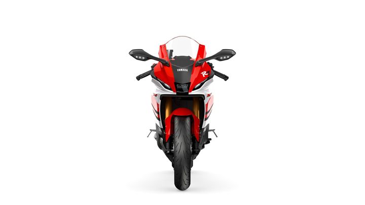 Front view of a Yamaha R1 motorcycle featuring a sleek design with red and white accents, LED headlights, and a prominent logo.