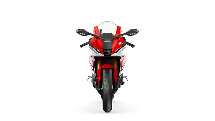 Front view of a Yamaha R1 motorcycle featuring a sleek design with red and white accents, LED headlights, and a prominent logo.