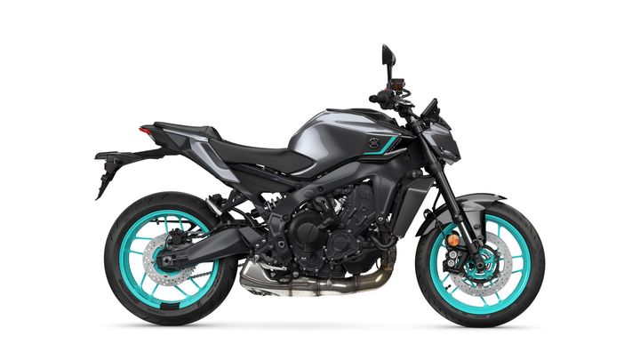 A sleek, modern motorcycle in matte black with teal accents on the wheels and a stylish design, displayed from a side angle against a white background.