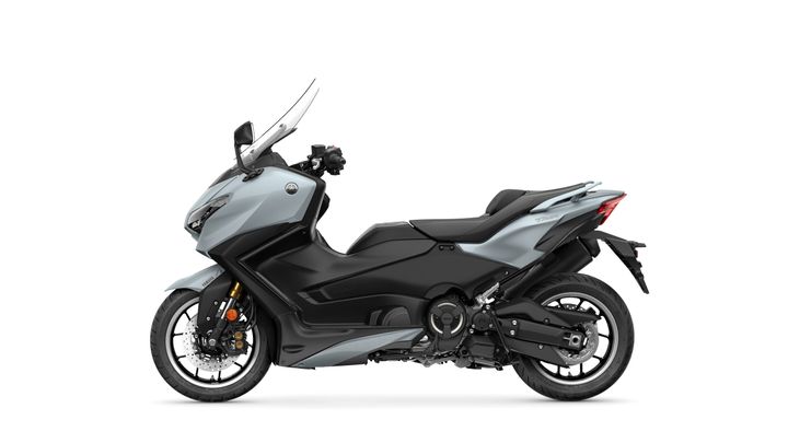 A sleek, modern motorcycle with a silver and black color scheme, featuring streamlined bodywork, a windscreen, and a sporty rear design, positioned against a white background.