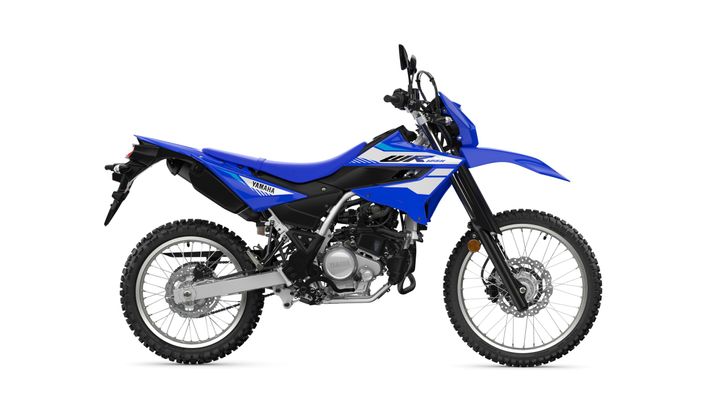 A blue Yamaha WR off-road motorcycle is depicted, showcasing its sleek design, knobby tires, and a mix of black and silver components on a white background.