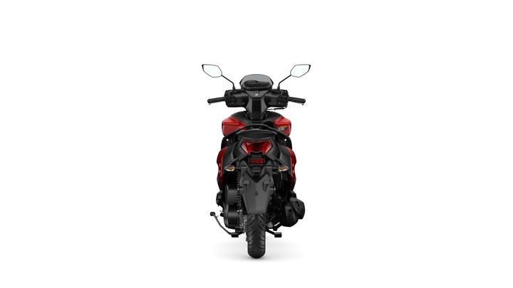 A rear view of a modern scooter showcasing a sleek design with a red and black color scheme, prominent tail lights, and a visible handlebar and mirrors.