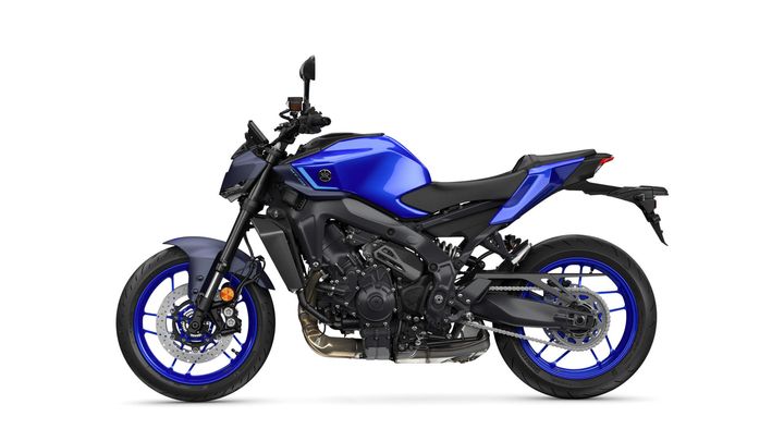 A blue and black motorcycle with a sleek design, featuring sporty wheels, exposed engine components, and a minimalist seat, set against a white background.