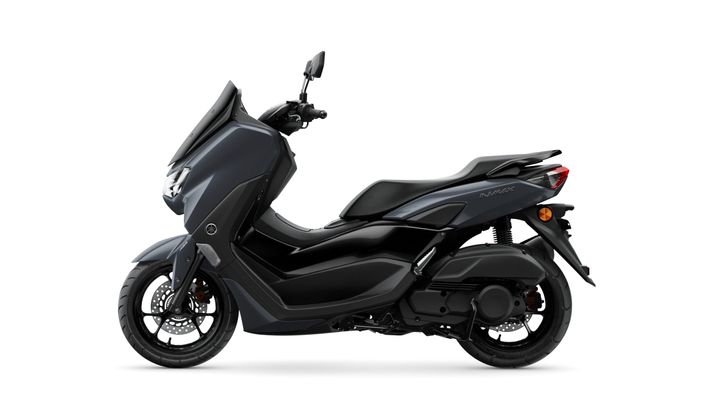 A sleek, modern scooter in dark gray, featuring a streamlined body design, a comfortable seat, and a large windshield, positioned against a white background.