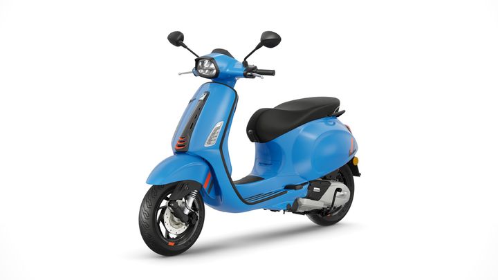 A blue motor scooter with black seat and details, displayed in side profile against a white background.